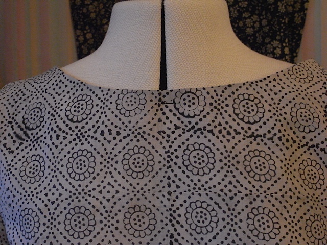 I put a couple of stitches at the neckline just to help the facing stay put.